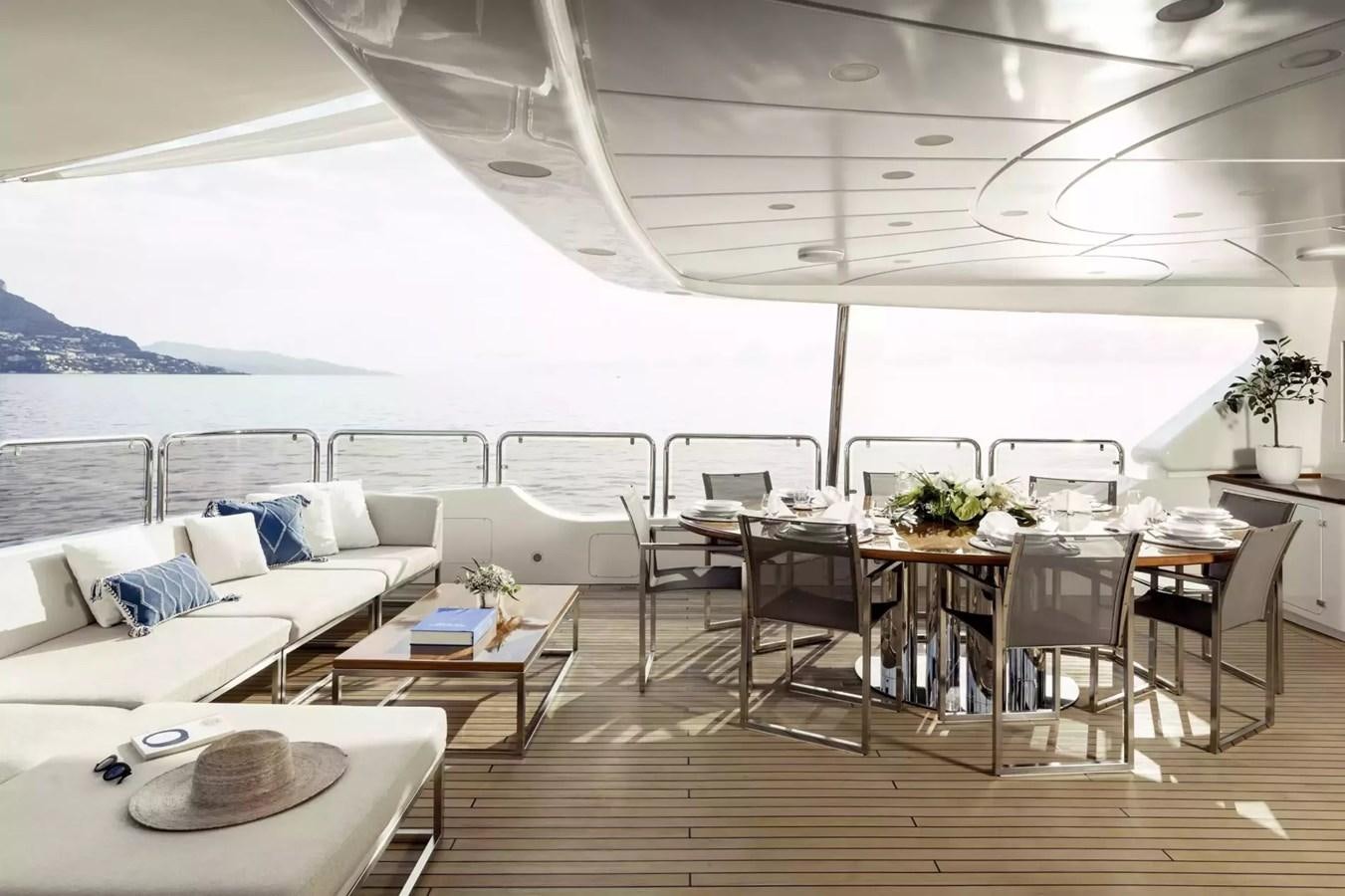 a room with a table and chairs aboard SOHO Yacht for Charter