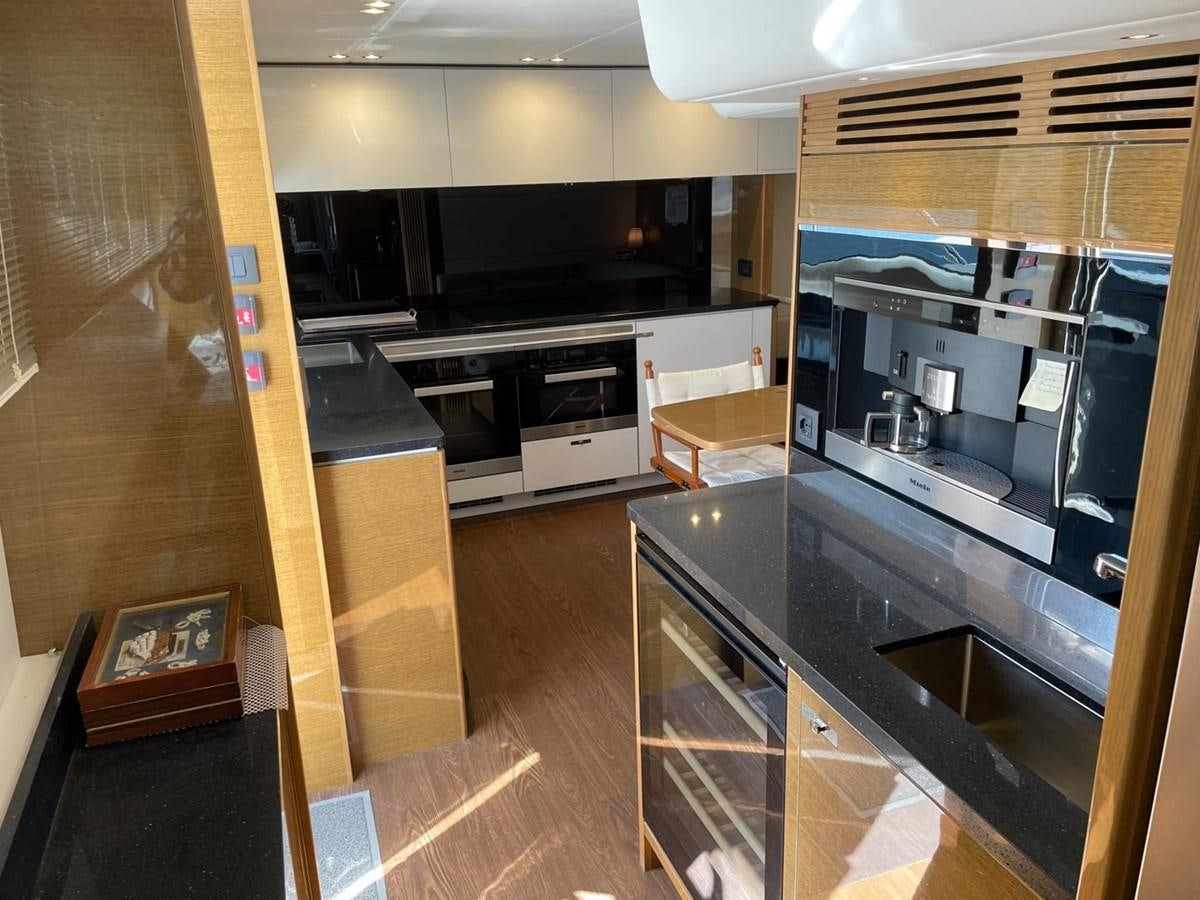 a kitchen with a large island aboard AFON Yacht for Sale