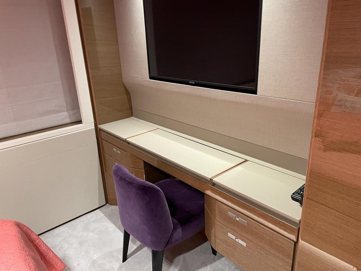 a chair in front of a tv aboard AFON Yacht for Sale
