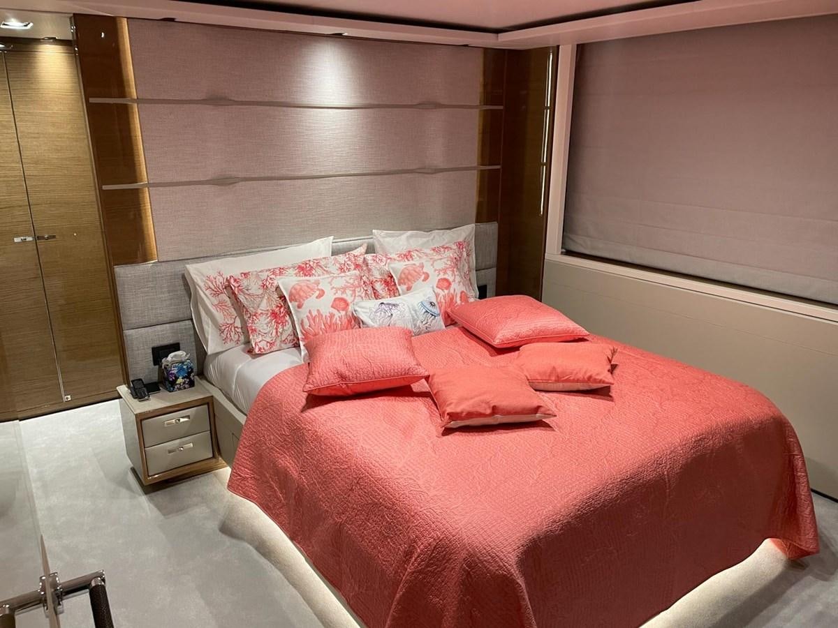 a bed with pink pillows aboard AFON Yacht for Sale