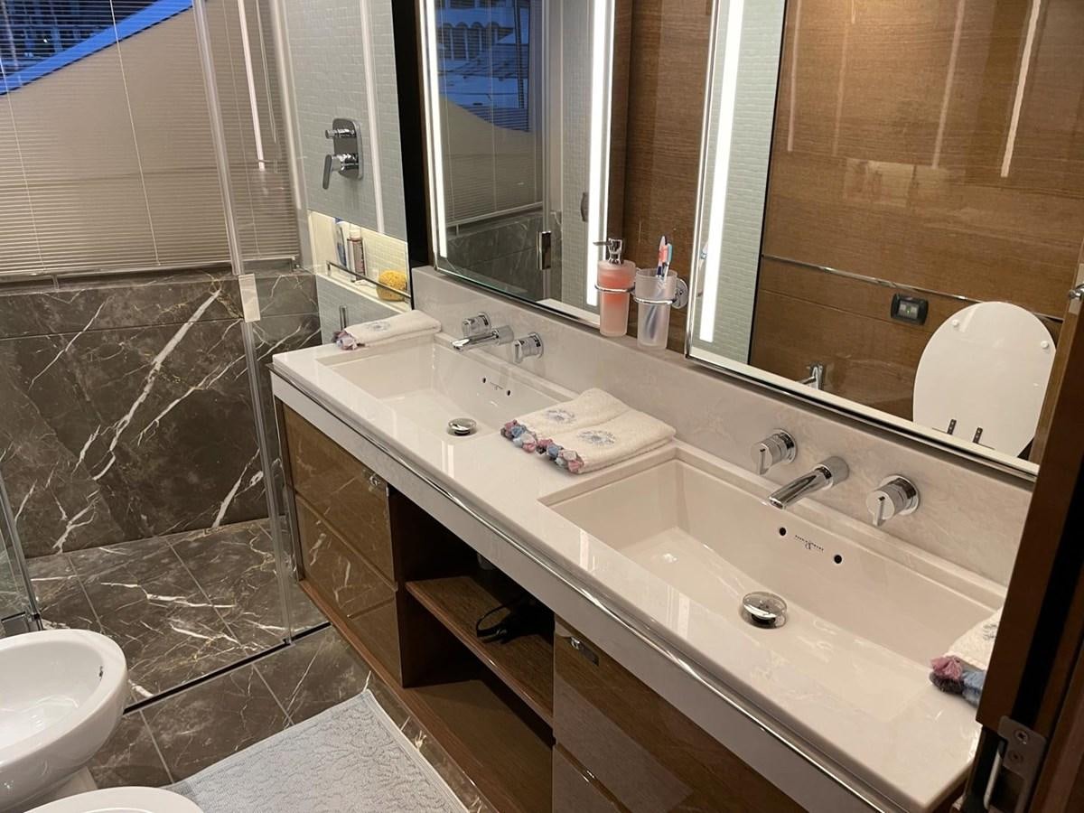 a bathroom with a glass shower aboard AFON Yacht for Sale