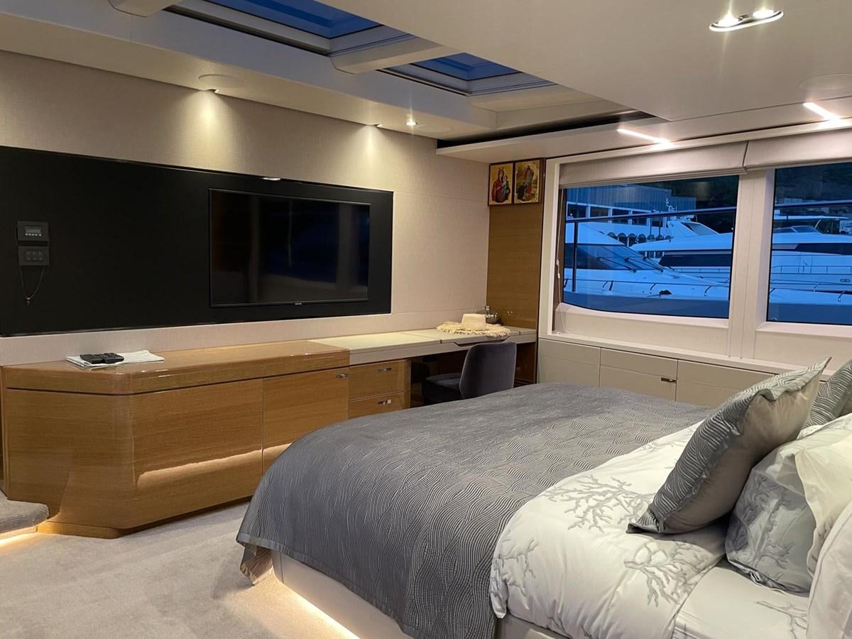 a bedroom with a bed and a tv aboard AFON Yacht for Sale