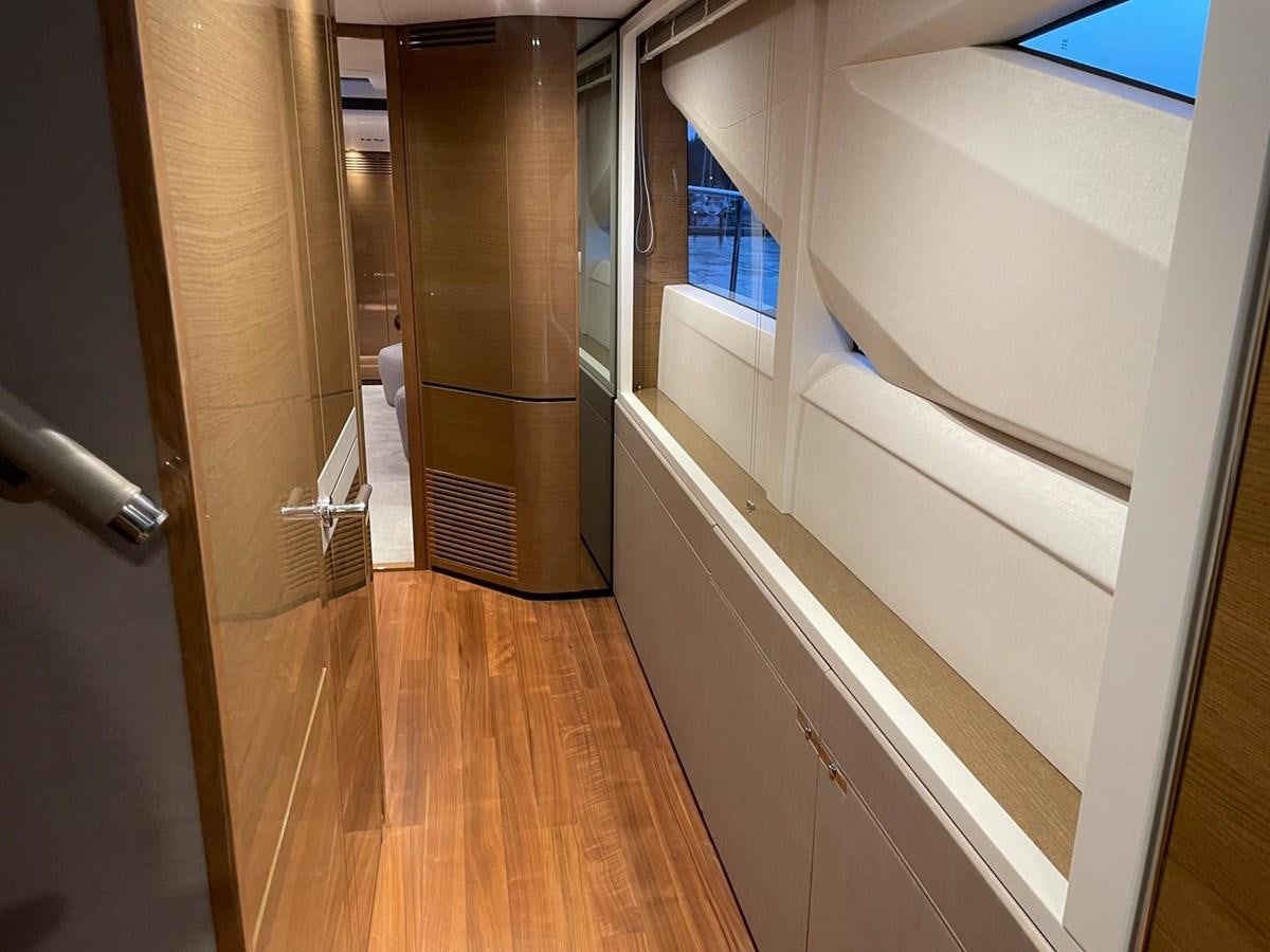 a hallway with a wood floor and a door with a window aboard AFON Yacht for Sale