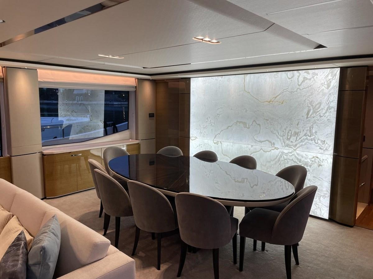 a room with tables and chairs aboard AFON Yacht for Sale