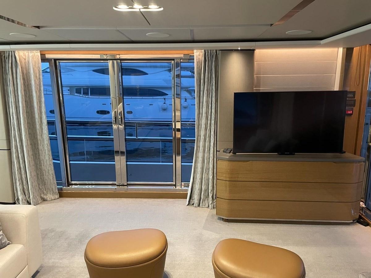 a room with a tv and a couch aboard AFON Yacht for Sale