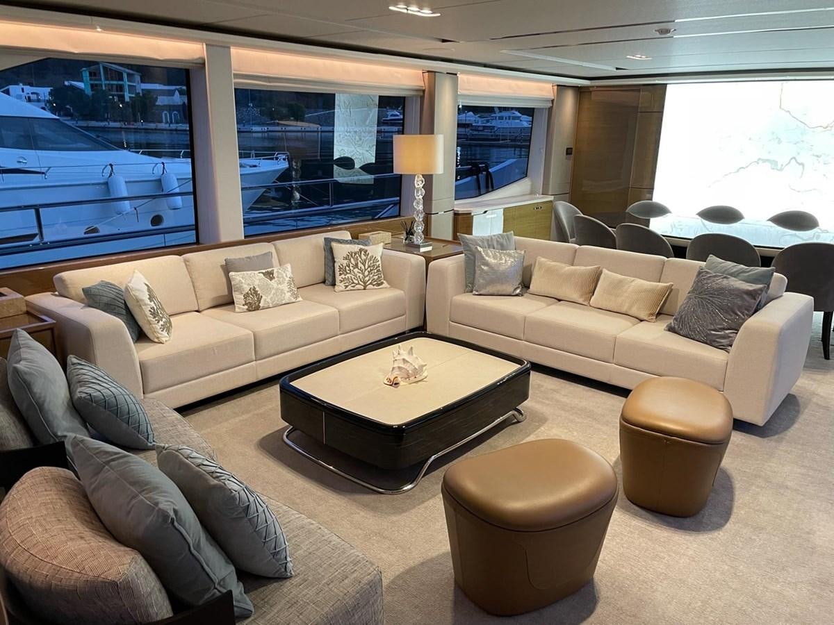 a living room with a couch and a table aboard AFON Yacht for Sale