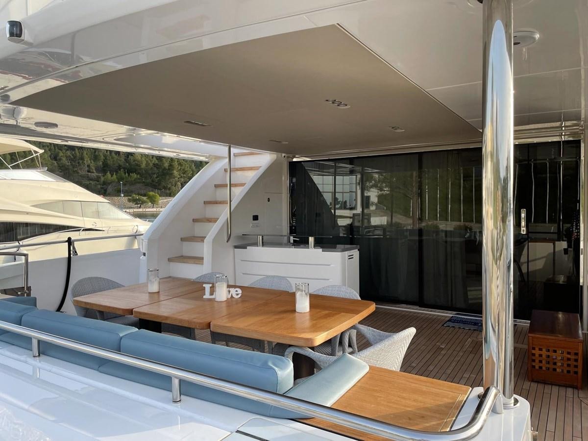 a room with a table and chairs aboard AFON Yacht for Sale