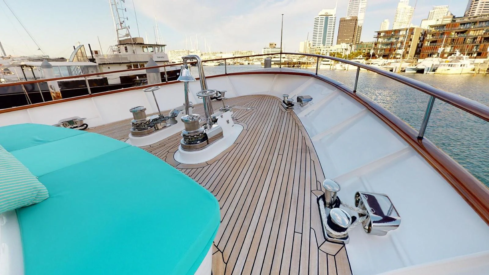 a deck with a table and chairs on it aboard ADYTUM Yacht for Sale