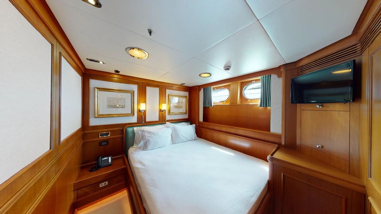 a room with two beds aboard ADYTUM Yacht for Sale