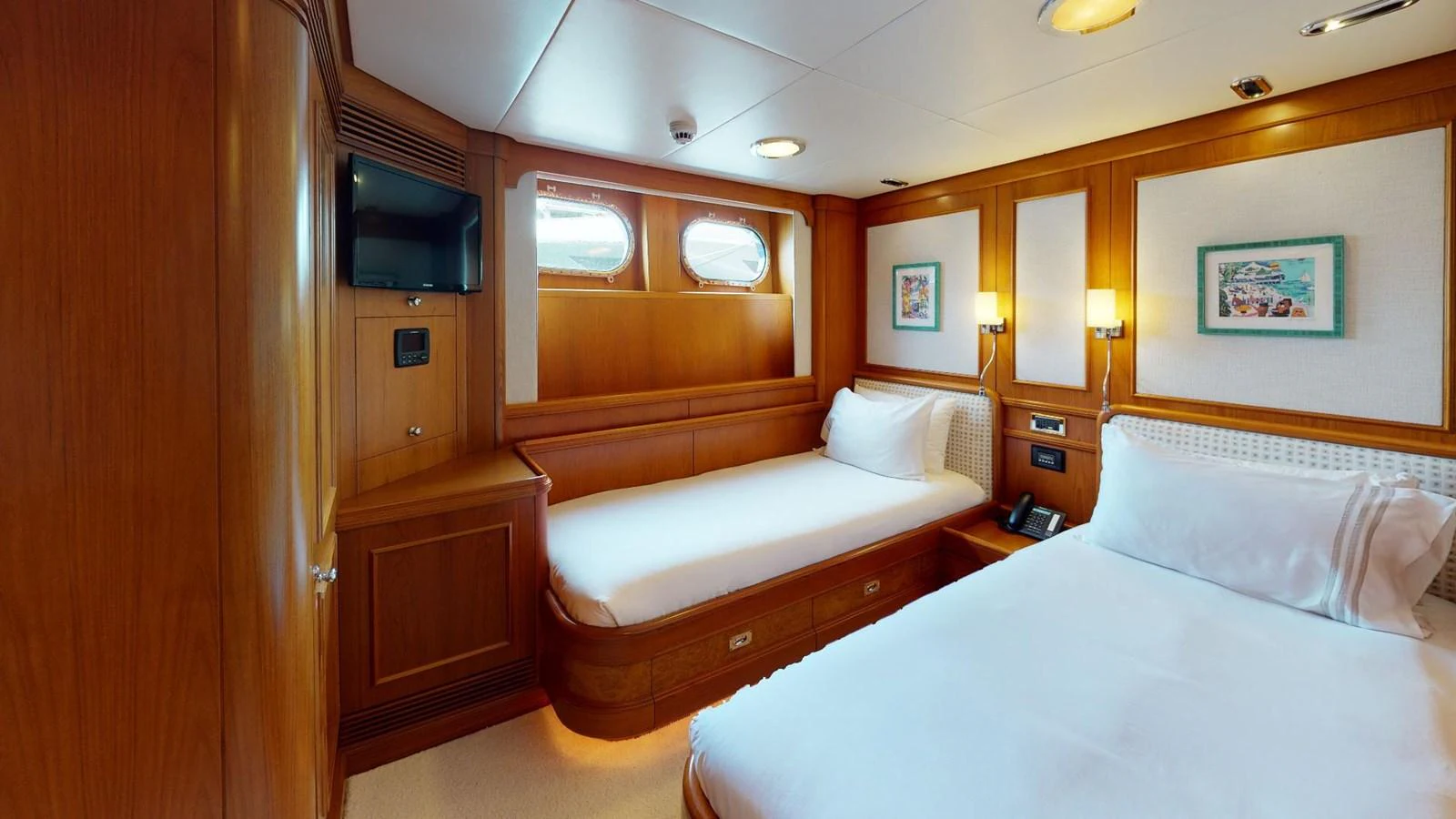 a room with two beds aboard ADYTUM Yacht for Sale