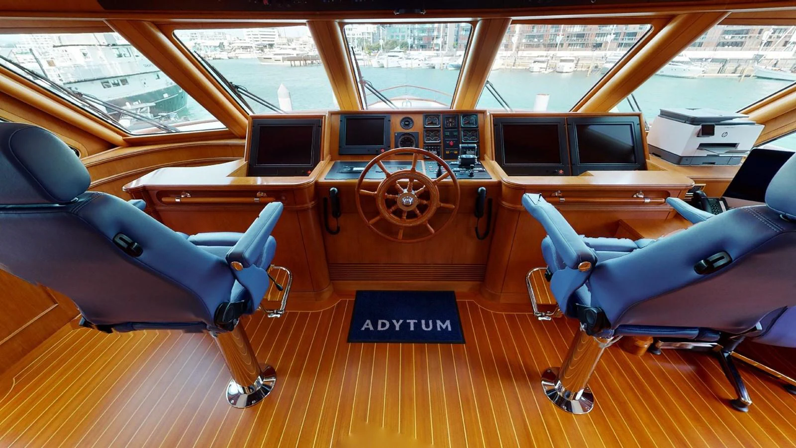 a room with a large round table and chairs aboard ADYTUM Yacht for Sale