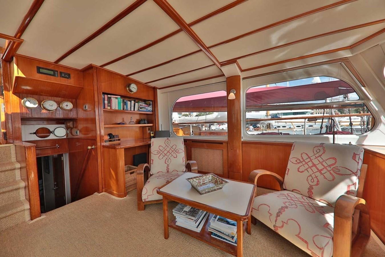 a living room with a large window aboard ATALANTA J Yacht for Sale