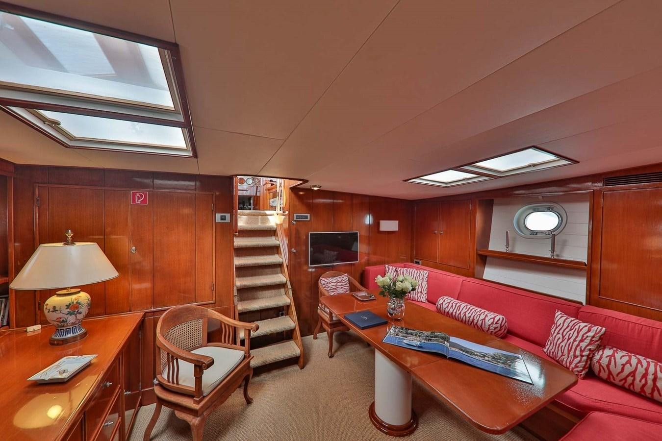 a living room with a staircase aboard ATALANTA J Yacht for Sale