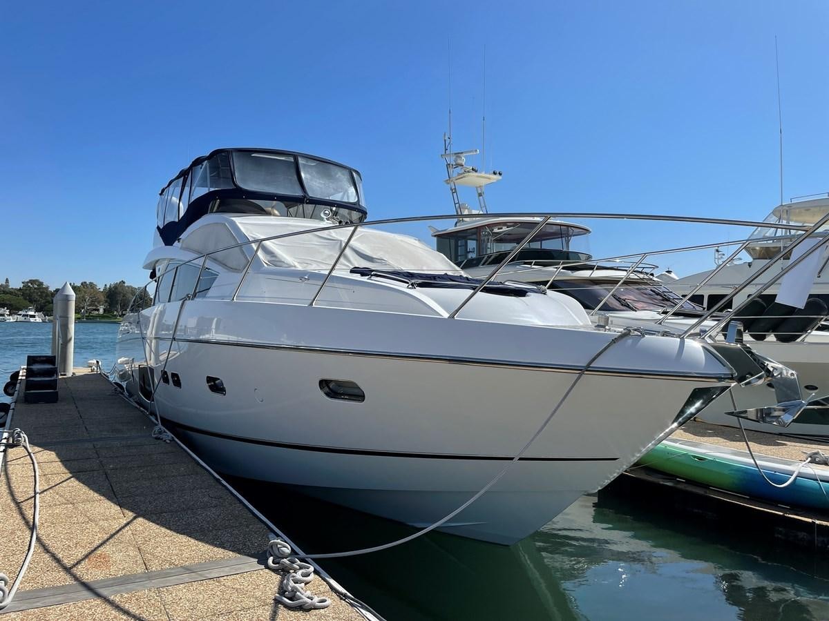 a white yacht docked aboard GRACE ELLEN Yacht for Sale