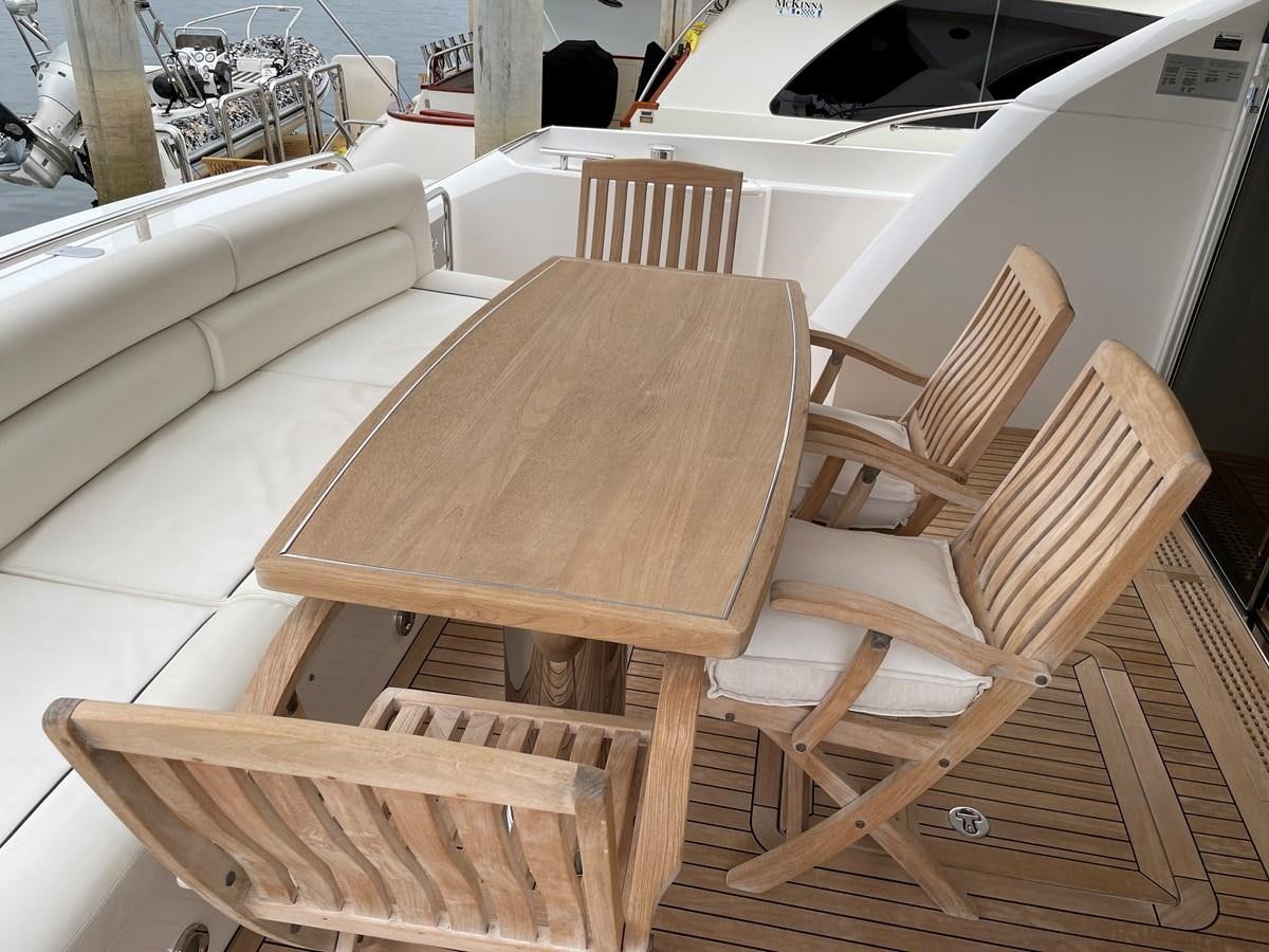 a wooden table on a boat aboard GRACE ELLEN Yacht for Sale