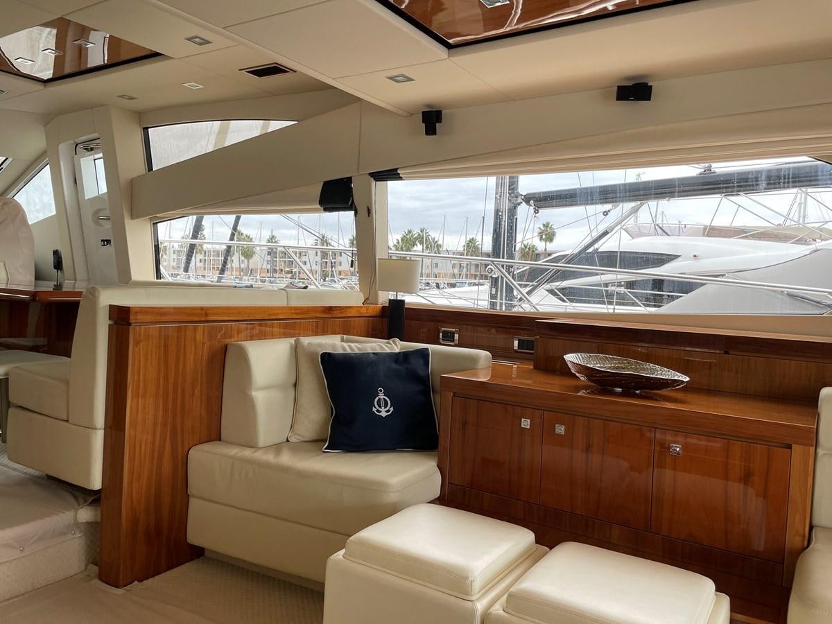 a room with a couch and a table aboard GRACE ELLEN Yacht for Sale