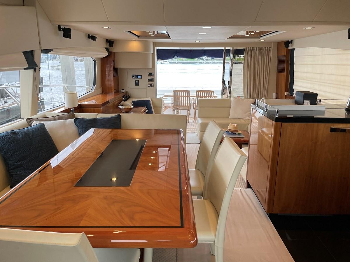 a room with a table and chairs aboard GRACE ELLEN Yacht for Sale