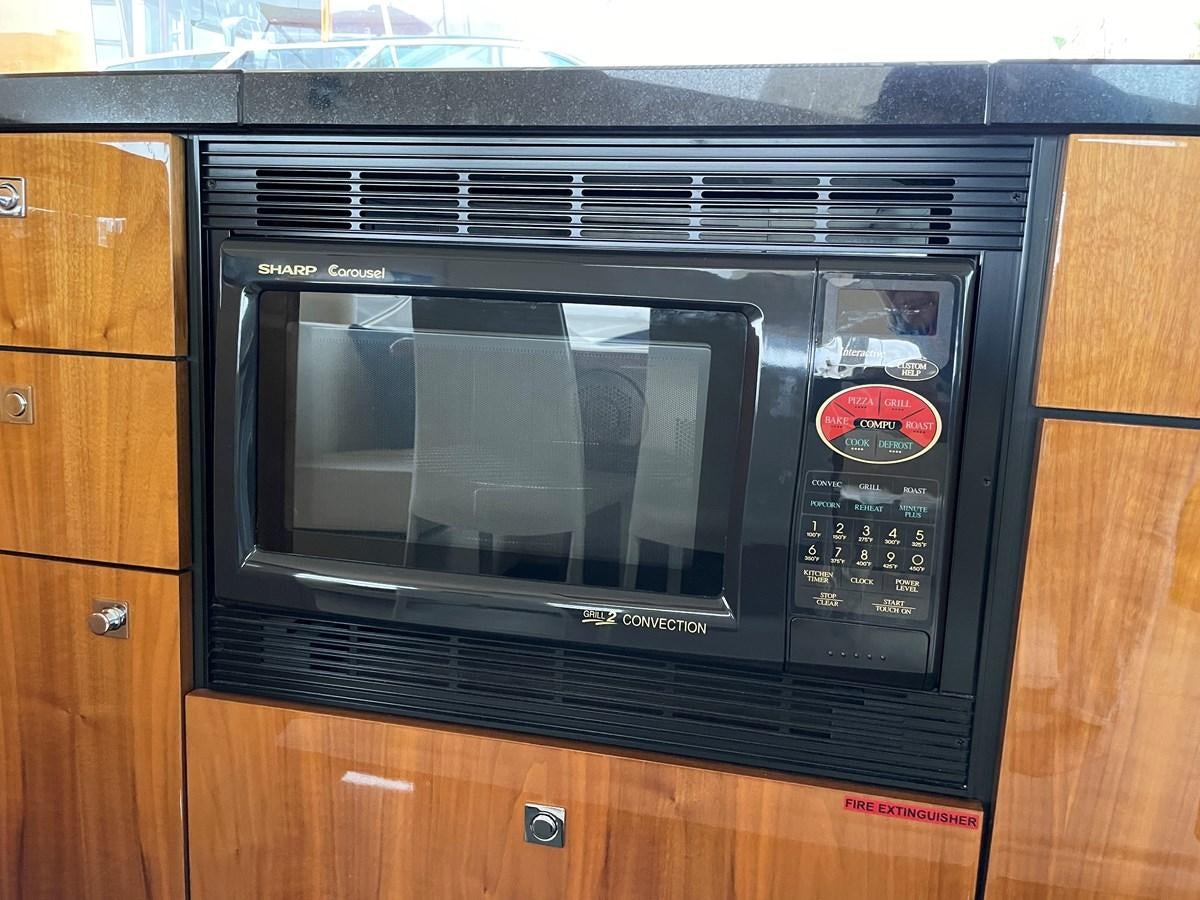 a microwave oven in a kitchen aboard GRACE ELLEN Yacht for Sale
