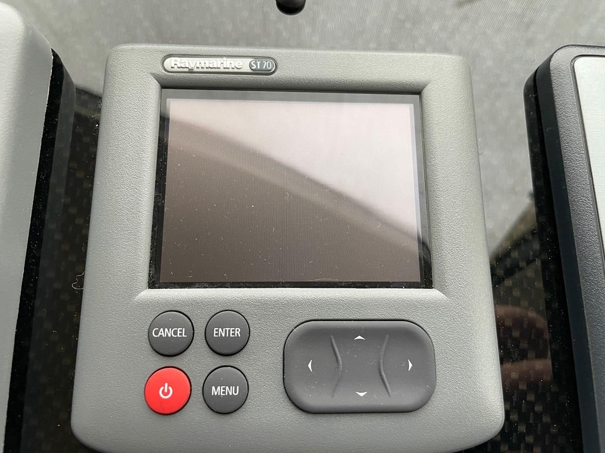 a cell phone on a table aboard GRACE ELLEN Yacht for Sale