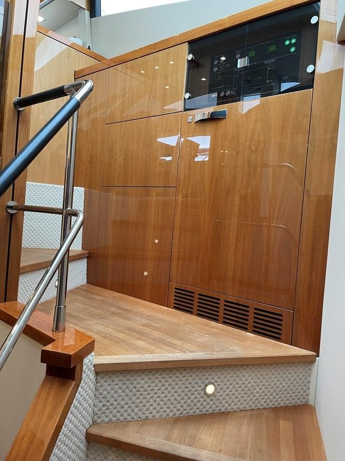 a wooden cabinet with a black radio aboard GRACE ELLEN Yacht for Sale