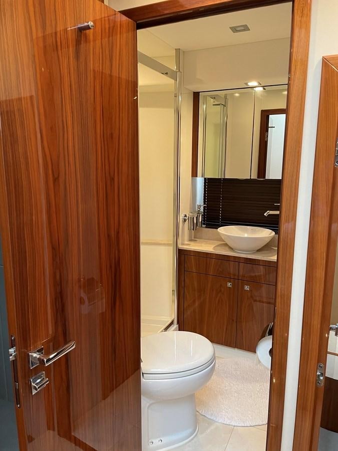 a bathroom with a toilet and a sink aboard GRACE ELLEN Yacht for Sale