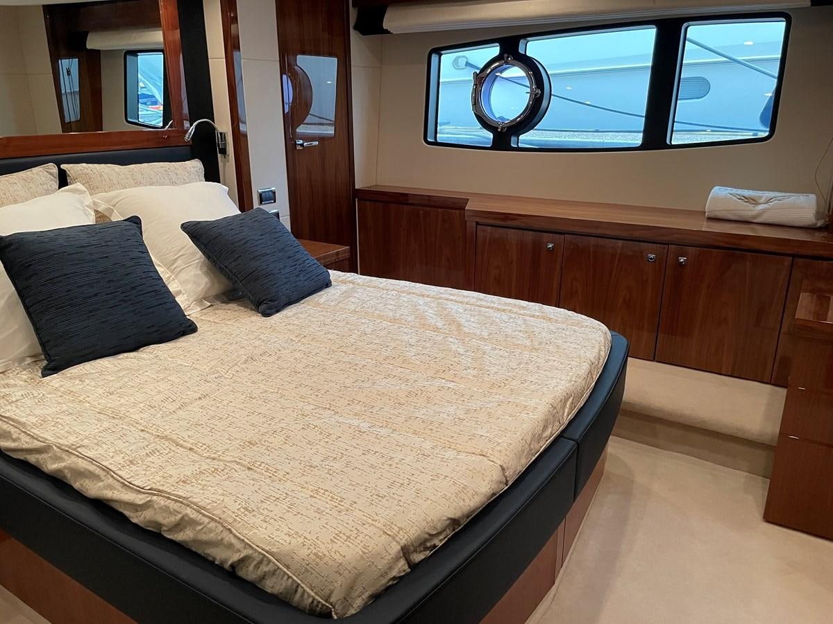a bed with pillows aboard GRACE ELLEN Yacht for Sale