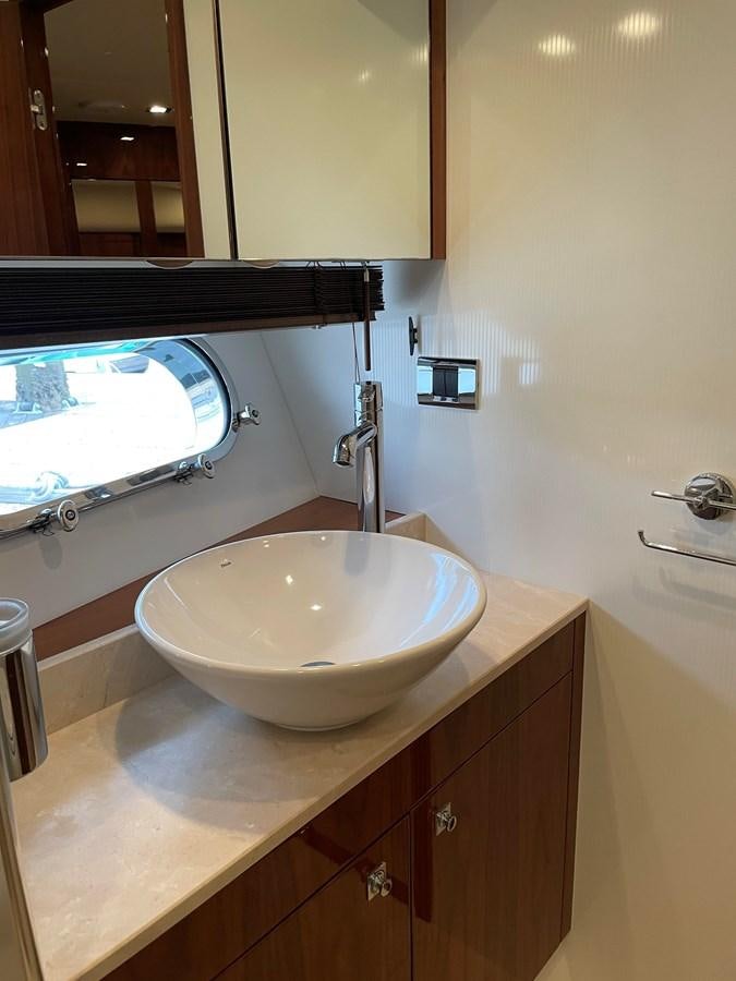 a bathroom with a sink and a mirror aboard GRACE ELLEN Yacht for Sale