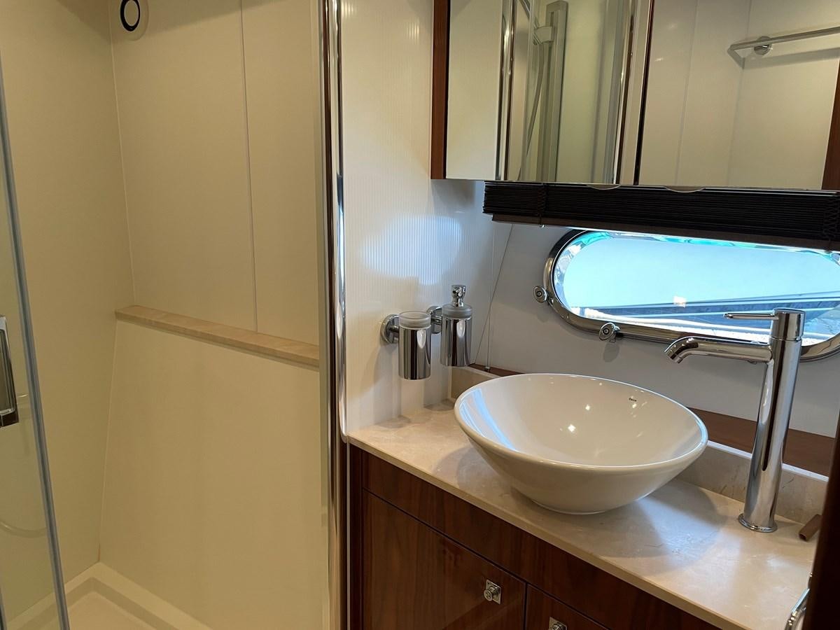 a bathroom with a sink and a mirror aboard GRACE ELLEN Yacht for Sale