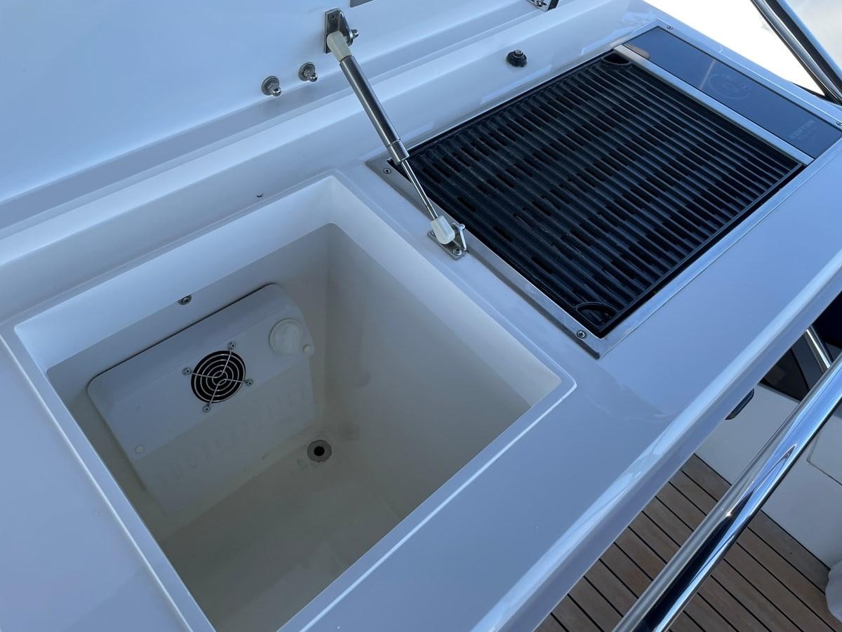 a bathtub with a shower head aboard GRACE ELLEN Yacht for Sale