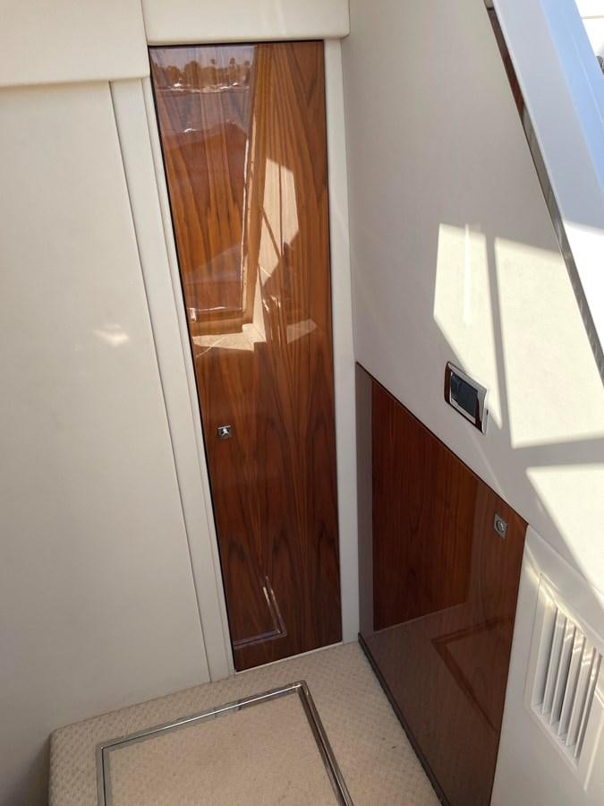 a wooden door with a mirror above it aboard GRACE ELLEN Yacht for Sale