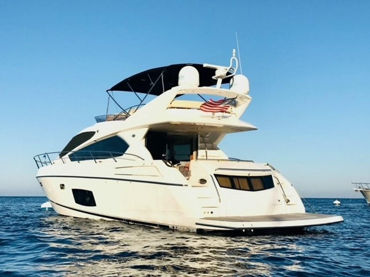 a white yacht on the water aboard MOONLIGHT DRIVE Yacht for Sale