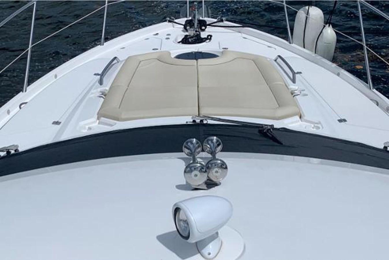 a white car with a hood aboard MOONLIGHT DRIVE Yacht for Sale