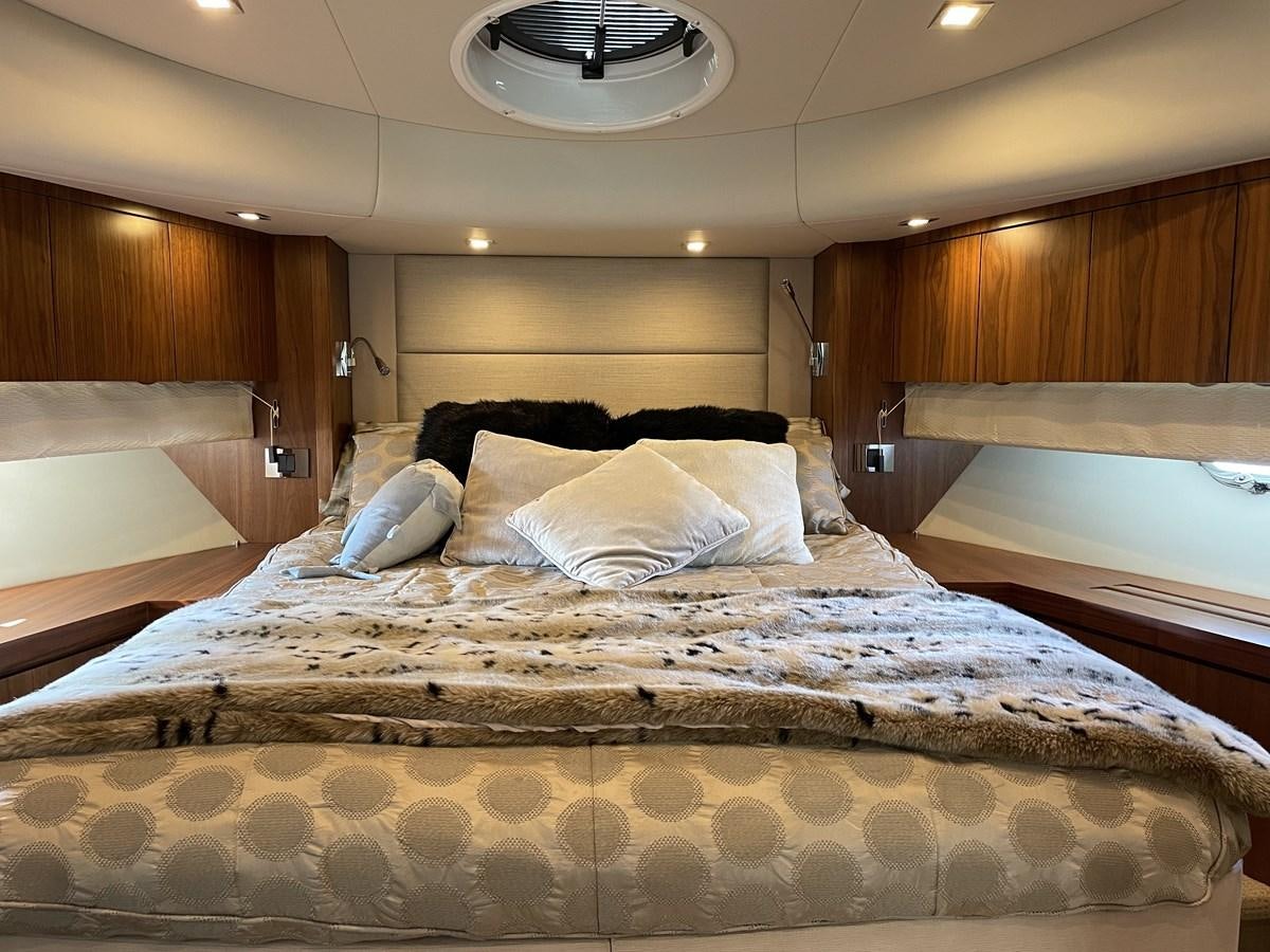 a bed with white sheets aboard MOONLIGHT DRIVE Yacht for Sale
