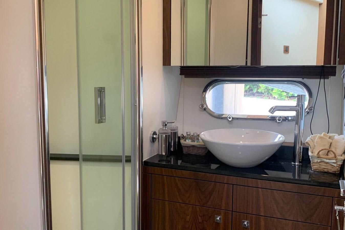 a bathroom with a sink and a mirror aboard MOONLIGHT DRIVE Yacht for Sale