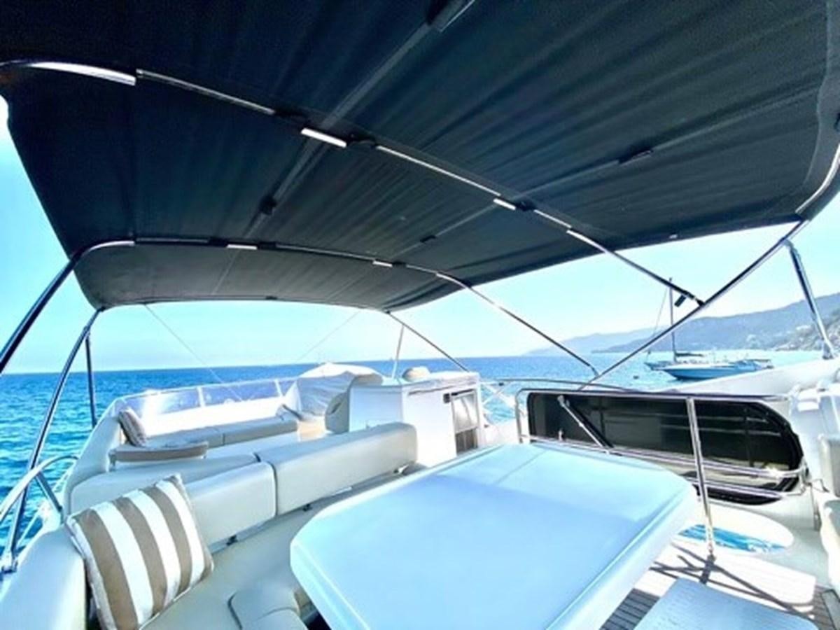 a boat with a blue canopy aboard MOONLIGHT DRIVE Yacht for Sale