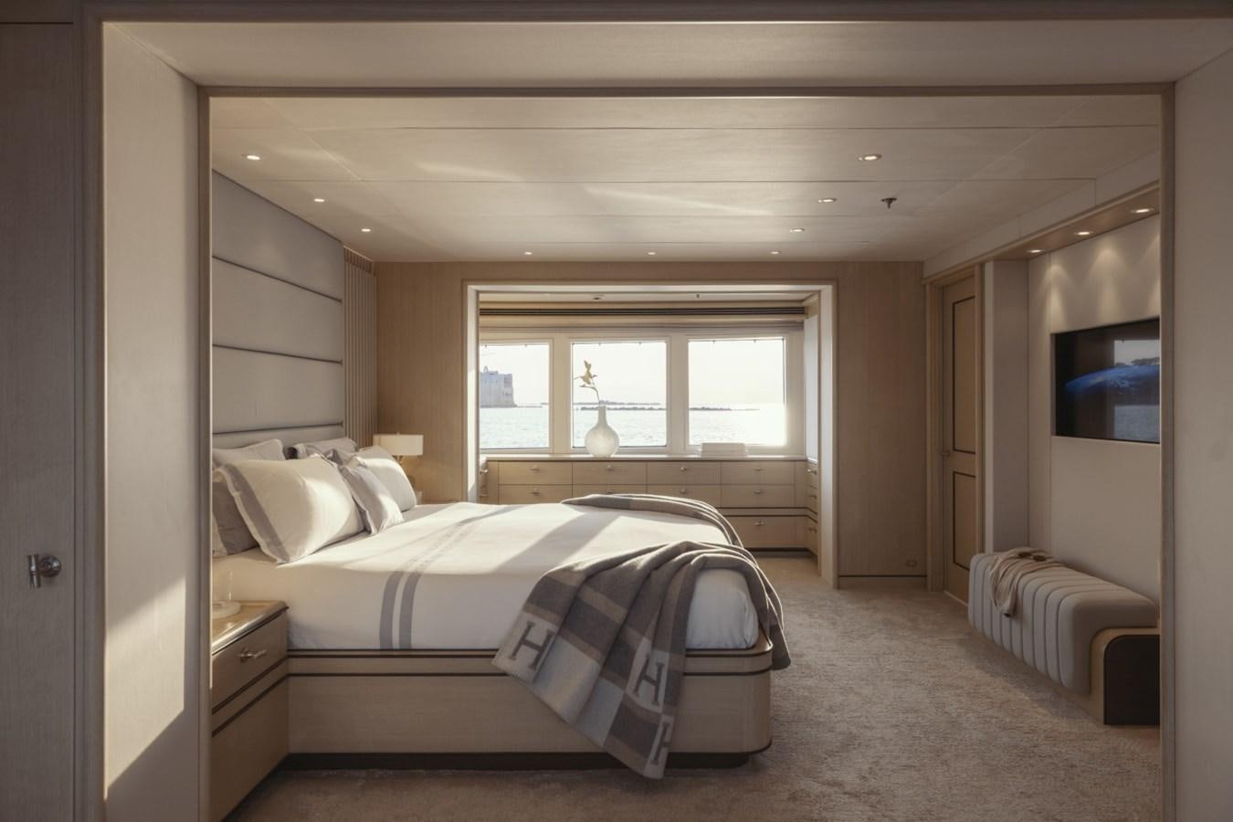 a bedroom with a large bed aboard LUCKY US Yacht for Sale