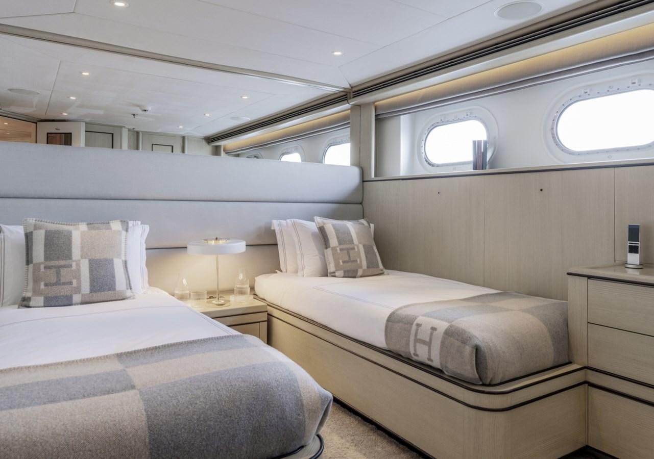 a room with two beds aboard LUCKY US Yacht for Sale