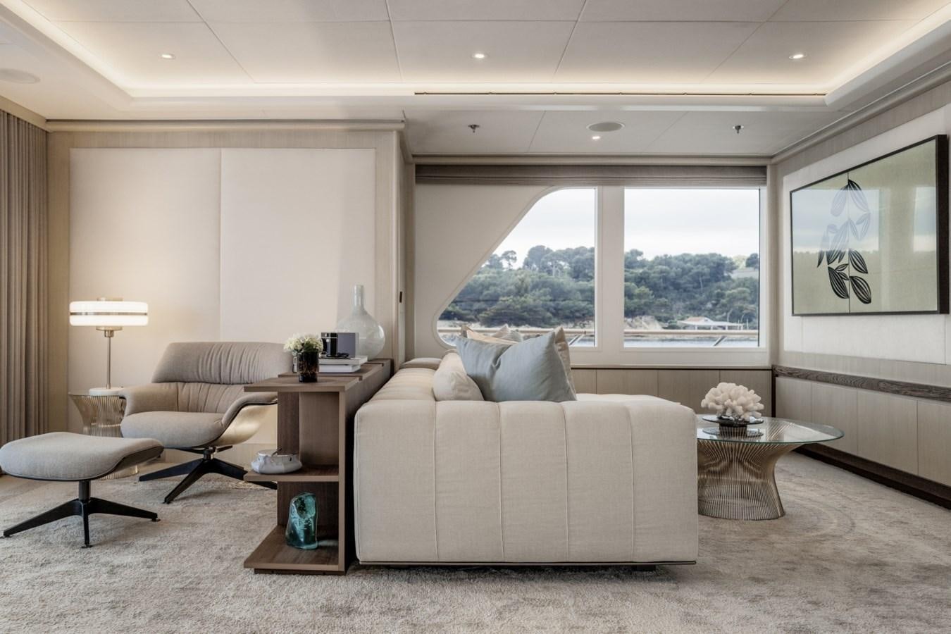 a living room with a large window aboard LUCKY US Yacht for Sale