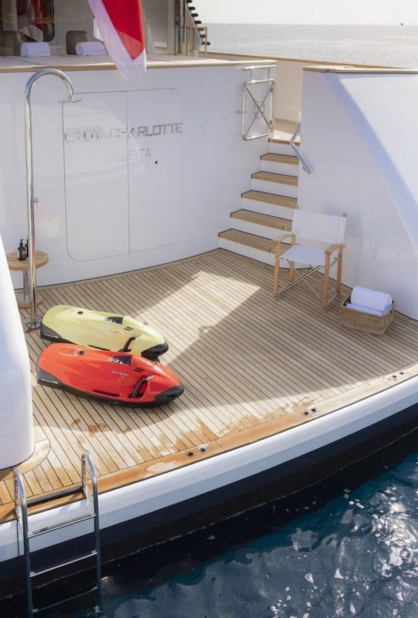a swimming pool with a red toy boat on it aboard LUCKY US Yacht for Sale