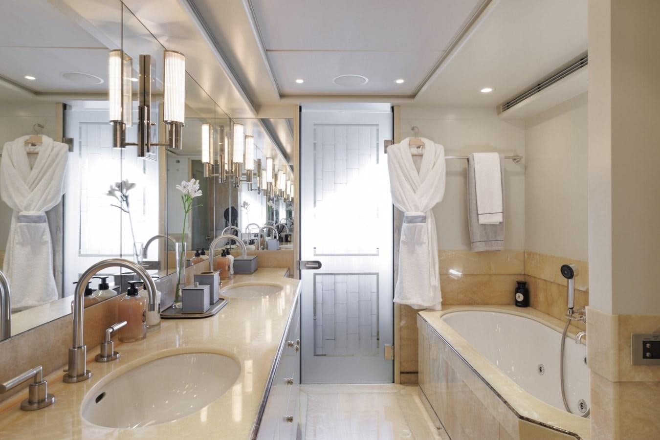 a bathroom with a sink and bathtub aboard LUCKY US Yacht for Sale