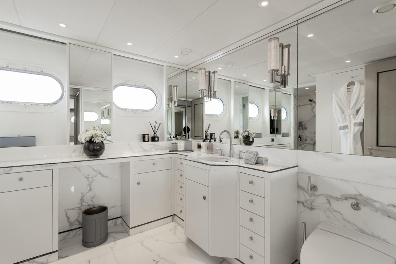 a bathroom with a large mirror aboard LUCKY US Yacht for Sale