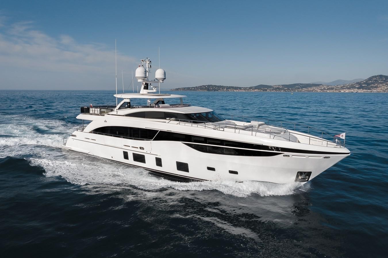 a white yacht on the water aboard RIVIERA LIVING Yacht for Sale