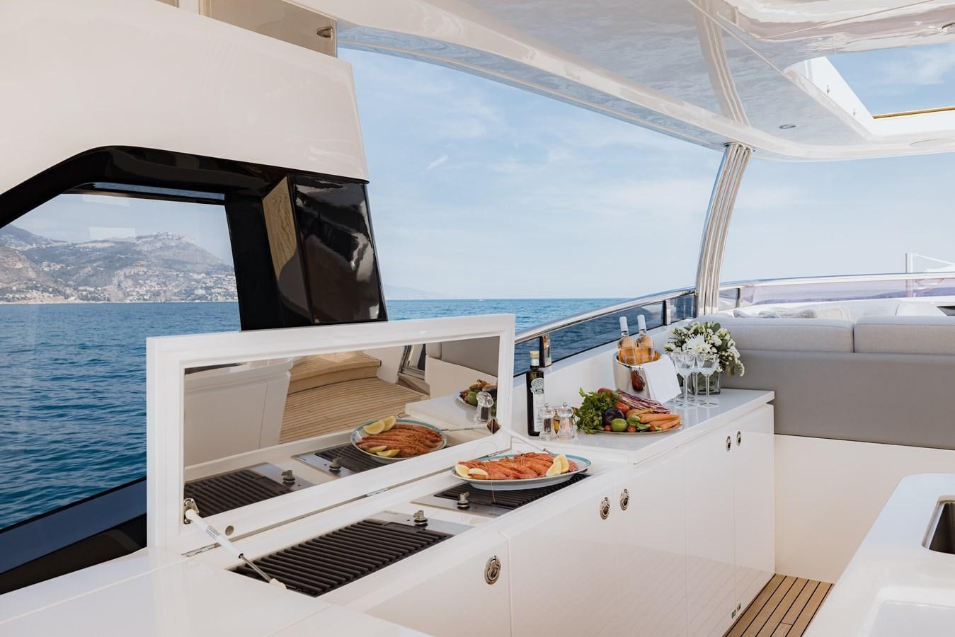 a boat with food on it aboard RIVIERA LIVING Yacht for Sale