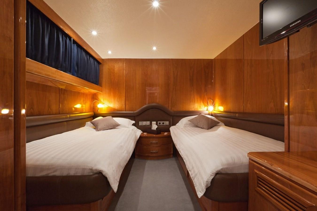 a room with a couple of beds aboard DUNE Yacht for Sale