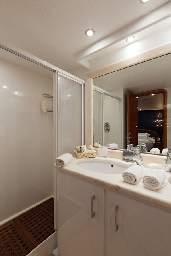 a bathroom with a sink and a mirror aboard DUNE Yacht for Sale