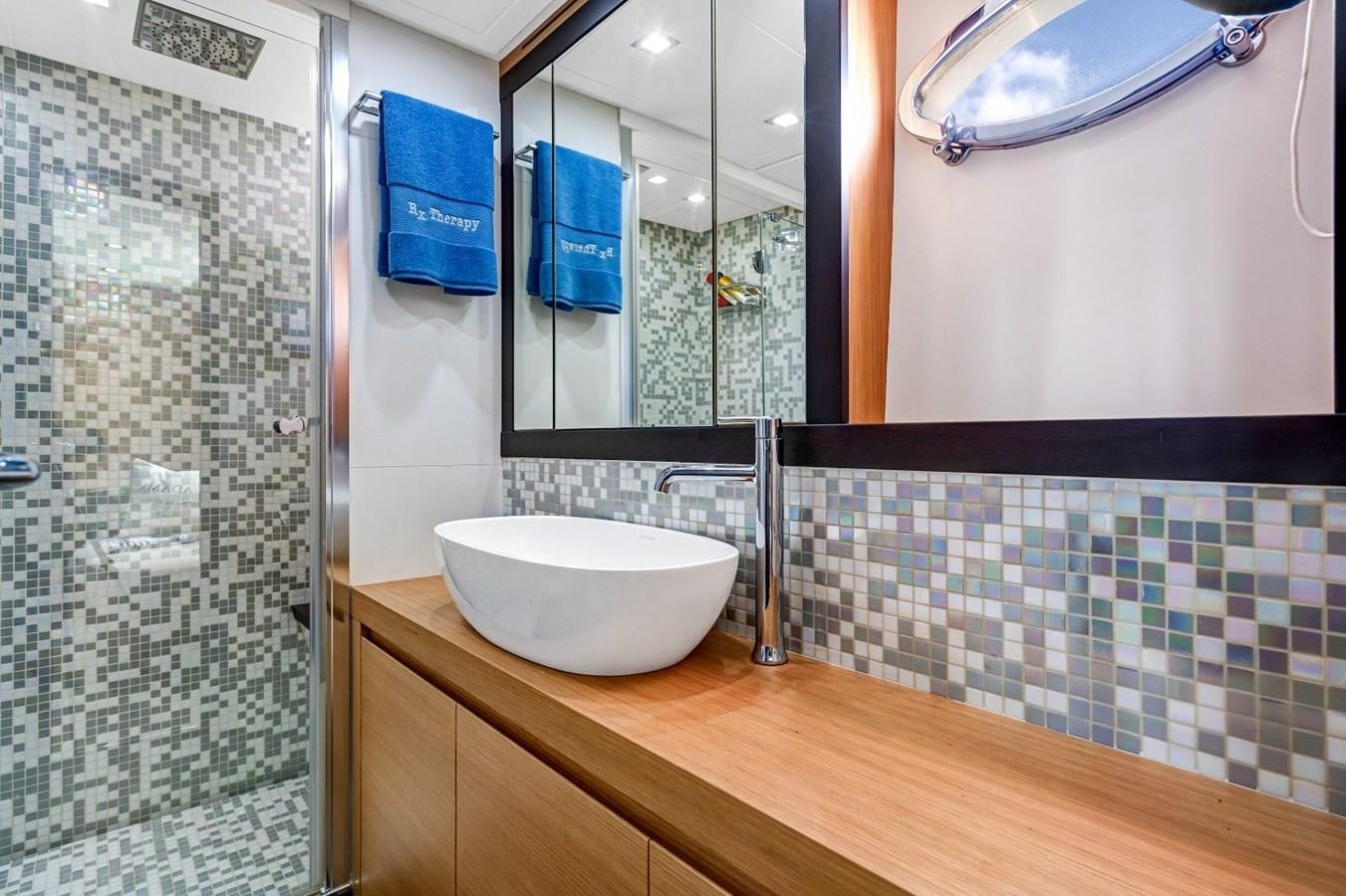 a bathroom with a sink and mirror aboard RX THERAPY  Yacht for Sale