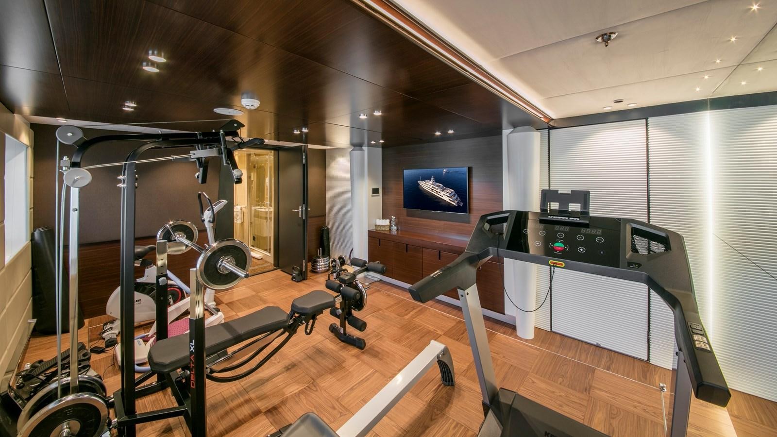 a gym with equipment aboard KATINA Yacht for Charter