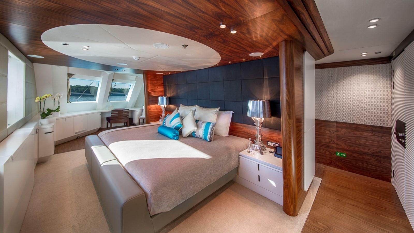 a large bedroom with a large bed aboard KATINA Yacht for Charter