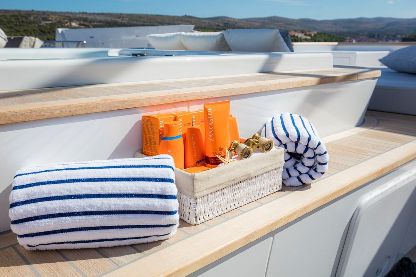 a boat with orange and blue towels aboard KATINA Yacht for Charter
