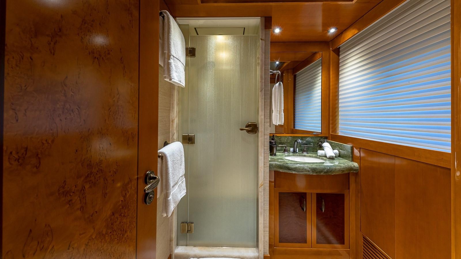 a bathroom with a sink and a shower aboard AS YOU WISH Yacht for Charter